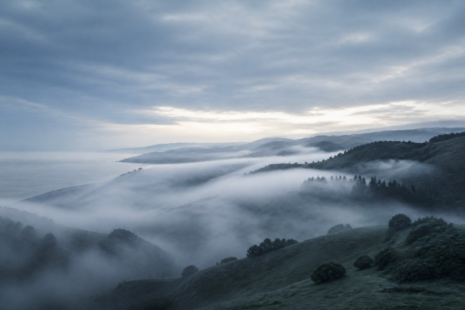 Mist over the hills — cutting through the fog